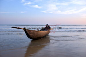 Kids Playing On Boat When The Daylight Fades In Tajpur Sea Beach, West Bengal